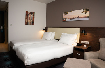 twin room with two single beds at OSKO Hotel near Toulouse Airport