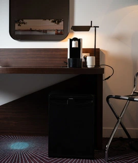 coffee machine and minibar in the premium double room at OSKO Hotel Toulouse Airport