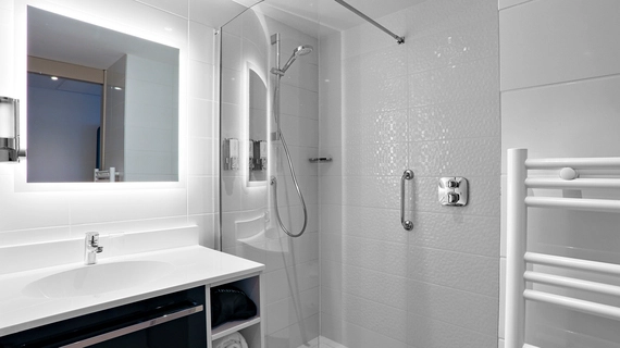 large modern high-pressure shower in a room at OSKO Hotel Toulouse Airport