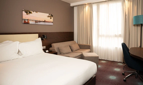 closed sofa bed in the standard double room at OSKO Hotel Toulouse-Blagnac